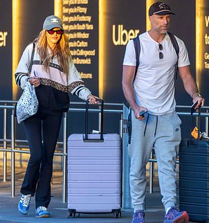 Rebecca Judd and her husband Chris went incognito on Wednesday as they jetted back into Australia after they spent the weekend partying it up at Coachella in the US.