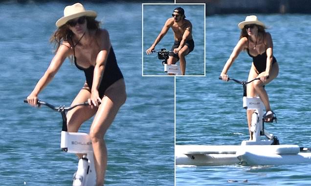 Gisele Bundchen, 44, almost spills out of her low-cut swimsuit in Miami just months after