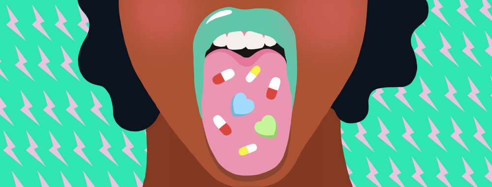 Woman sticking out tongue with pills